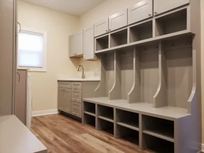 custom-mudroom-built-ins-storage-cubbies-aspect-ratio-400-300 Custom mudroom built-ins with storage cabinets, open cubbies, coat hooks, bench seating and utility sink