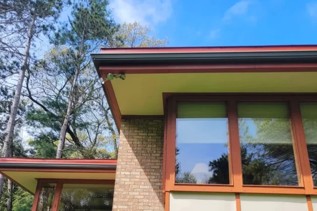 exterior-fascia-soffit-repair-aspect-ratio-960-640 Exterior fascia and soffit repair on a brick home with large windows