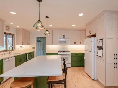 green-cabinets-kitchen-remodel-aspect-ratio-400-300 Updated kitchen with green lower cabinets, light wood upper cabinetry, quartz countertops and large island
