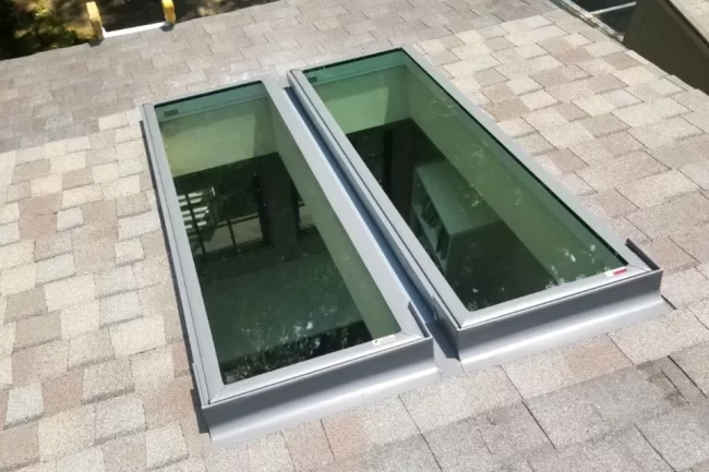 skylight-replacement-aspect-ratio-960-640 Replacement of two skylight installed on a shingle roof
